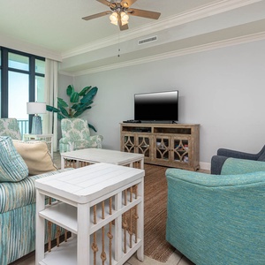 Relax in the cozy living room, featuring a queen sofa sleeper, and enjoy inviting moments of pure tranquility