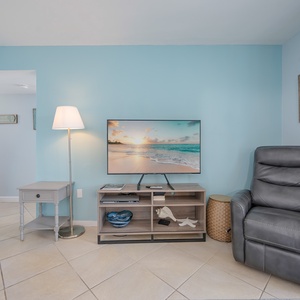 Unwind in a plush recliner and enjoy streaming your favorite shows as you soak in the beachy vibe all around you