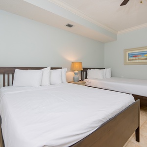 Experience peaceful rest on two queen beds, thoughtfully arranged for comfort, in this guest suite