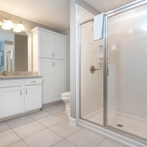 Indulge in relaxation in this guest bathroom, featuring elegant fixtures and a rejuvenating shower experience