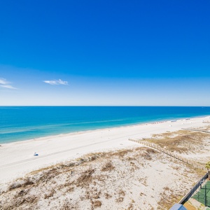 Gaze at the serene waters and soft shoreline, perfect for a relaxing day under the sun