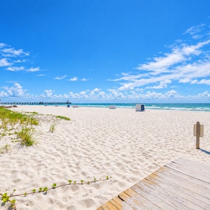 Experience the stunning beach view with gentle waves and soft sand, perfect for relaxing and soaking up the sun