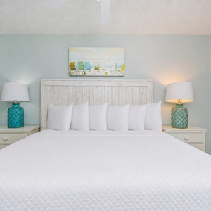 Two bedside lamps glow softly beside the king bed in the master suite where you dream peacefully