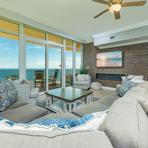 Unwind in the spacious living room with a large flat screen and beautiful electric fireplace