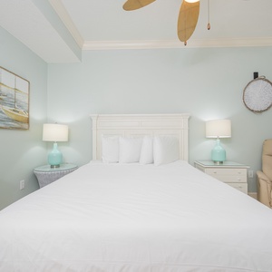 Drift into a peaceful slumber surrounded by soft bedding and soothing coastal decor in this queen guest suite