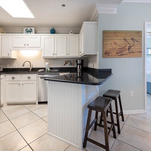 Prepare meals in this stylish, featuring stainless appliances and a welcoming atmosphere