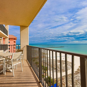 Savor your morning coffee at the outdoor table while enjoying expansive views of the tranquil waters and shoreline