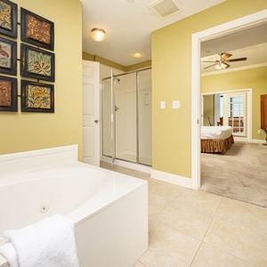 Indulge in relaxation in the master bath with a refreshing walk-in shower and soothing jetted tub