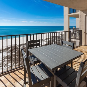 Relax on the balcony while enjoying breathtaking views of the tranquil waters and beach