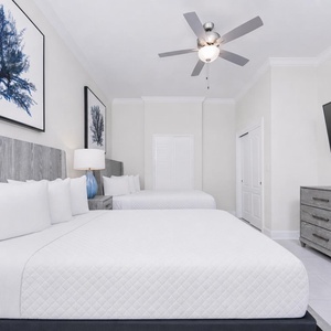 Unwind in this stylish queen guest suite and stream your favorite shows or enjoy a good movie after a beach day