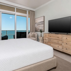 Enjoy gulf breezes from the king bed in the master bedroom while balcony chairs frame the shoreline