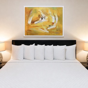 This cozy bedroom features a vibrant yellow artwork above the king bed, complemented by stylish lamps and plush pillows