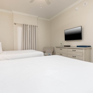 Unwind in this queen guest suite and stream your favorite shows or enjoy a good movie after a beach day