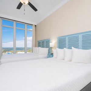 Enjoy and evening sunset in this queen guest suite with two cozy beds and expansive views from the windows