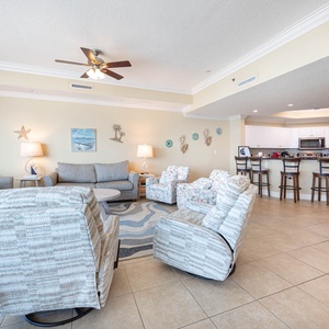 Relax in the comfy chairs, sharing laughter and stories while enjoying the bright coastal vibe surrounding you