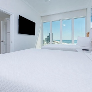 Curl up on inviting bedding and enjoy the gulf view through the windows and enjoy a good movie