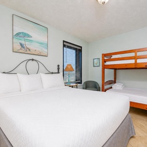 Drift into restful slumber in this cozy guest bedroom, featuring a double bed and charming twin bunk