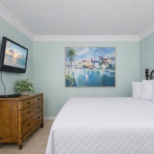 Unwind in this king guest suite, enjoying your favorite shows on the TV while the beach vibe enhances your relaxation