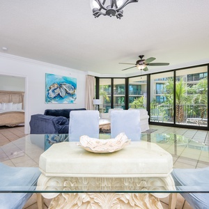 Discover relaxation in the airy living space, where sunlight streams through large windows, inviting the outdoors in