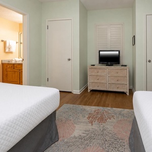 Unwind in this guest suite with two double beds and enjoy a good movie after a beach day