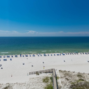 Relax with views of the pristine beach and vibrant umbrellas from your private balcony on the eleventh floor