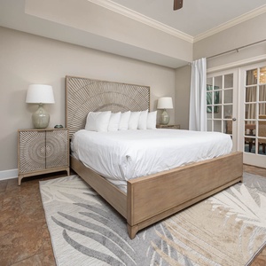 Unwind after a day at the beach in this elegant king master suite surrounded by stylish accents