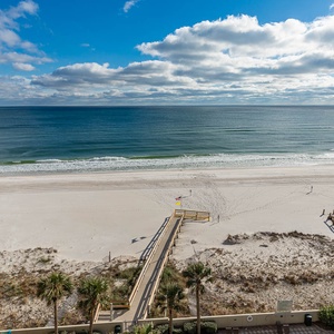 Breathe in the fresh air as you relax on your balcony, enjoying the vibrant beach views and gentle waves below