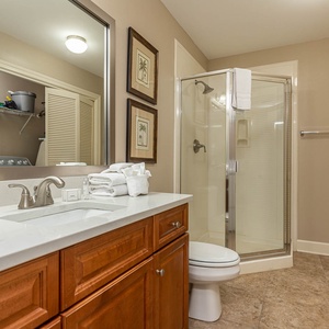 Refresh in this additional guest bath with a walk-in shower and laundry area with a washer and dryer in your rental