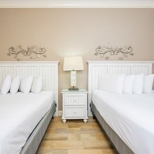 Rest in this queen guest suite, where soft linens invite you to recharge for exciting beach adventures ahead