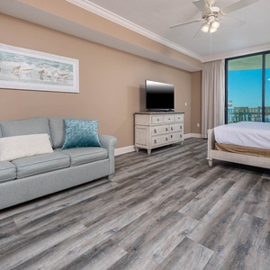 Relax in this master suite with a cozy king bed, seating area, and balcony overlooking the tranquil gulf waters