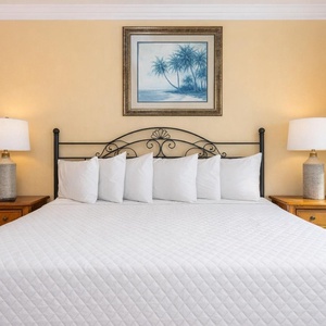 Awake refreshed in the master, soaking in the soothing coastal vibe through the window's inviting view