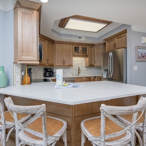 Enjoy a cup of coffee at the inviting breakfast bar while soaking in the serene coastal atmosphere