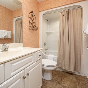 Rejuvenate in the guest bath, with plush towels and a shower perfect for unwinding after a day by the coast