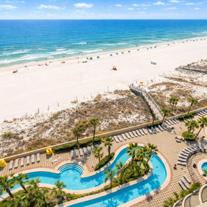 Sunny resort pool by the beach