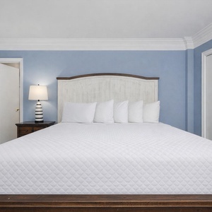 Enjoy a peaceful night's sleep surrounded by soft, plush bedding in your inviting king suite