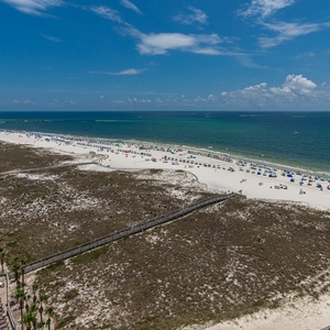 Breathe in the coastal air from the balcony, savoring the expansive views and soothing sounds of the shore