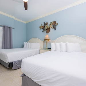 Relax on one of the cozy queen beds in this guest suite and enjoy a peaceful slumber