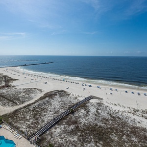 Breathtaking views from your balcony, overlooking the beach and inviting waters, perfect for relaxation