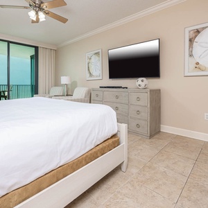 Relax in this master suite bedroom featuring a plush king bed, stylish decor, and a view that invites you to unwind