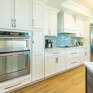 Upgrade your culinary experience in this stylish kitchen with modern stainless appliances and elegant design