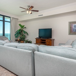 Unwind in the plush sectional with a queen sleeper, enjoying cozy movie nights with loved ones