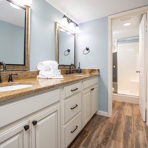 Refresh in this stylish master bath featuring dual sinks and a walk-in shower