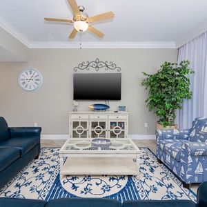 Unwind on the comfortable couches, enjoying the coastal-inspired decor and the gentle breeze flowing through