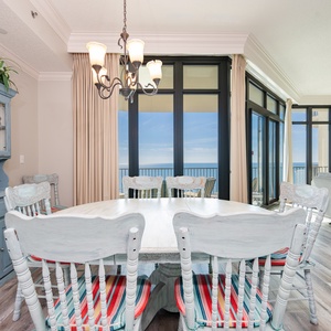 Gather around the dining table, sharing laughter and stories while basking in the coastal views