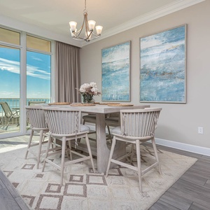 Gather around the stylish dining table and enjoy laughter and conversation with loved ones, while enjoying coastal views