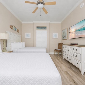 Unwind in this queen guest suite and stream your favorite shows or enjoy a good movie after a beach day