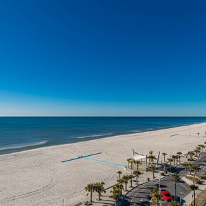 Gaze at the expansive shoreline and tranquil waters, perfect for relaxing beach days and scenic strolls