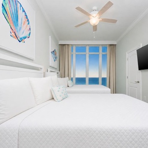 Turn on the TV, settle onto soft pillows, and admire the beach from this charming queen suite