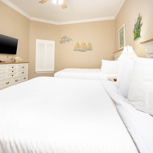 Snuggle into the queen beds, unwind while streaming your favorite shows in this relaxing guest room