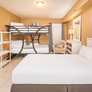 Twin bed and full over full bunk offer restful spots for your family to recharge after coastal adventures